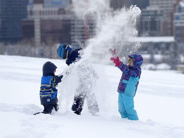 Grace Woods-Sellers, 9, right and her siblings Micah, 11, middle and Ben, 6 enjoy the winter wonderland in Calgary, on Wednesday December 20, 2017.