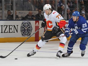TORONTO,ON - DECEMBER 6:  Mark Jankowski #77 of the Calgary Flames skates away from a checking Connor Brown #28 of the Toronto Maple Leafs during an NHL game at the Air Canada Centre on December 6, 2017 in Toronto, Ontario, Canada. The Maple Leafs defeated the Flames 2-1 in an overtime shoot-out.