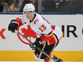 Johnny Gaudreau #13 of the Calgary Flames skates with the puck against the Toronto Maple Leafs during an NHL game at the Air Canada Centre on December 6, 2017 in Toronto, Ontario, Canada.