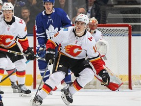 TORONTO,ON - DECEMBER 6:  Matthew Tkachuk #19 of the Calgary Flames defends against the Toronto Maple Leafs during an NHL game at the Air Canada Centre on December 6, 2017 in Toronto, Ontario, Canada. The Maple Leafs defeated the Flames 2-1 in an overtime shoot-out.