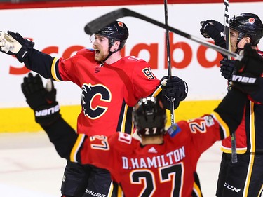 The Calgary Flames celebrate Sam Bennett's game winning goal against the Vancouver Canucks late in the third period during NHL action in Calgary Saturday December 9, 2017.