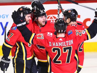 The Calgary Flames celebrate Sam Bennett's game winning goal against the Vancouver Canucks late in the third period during NHL action in Calgary Saturday December 9, 2017.