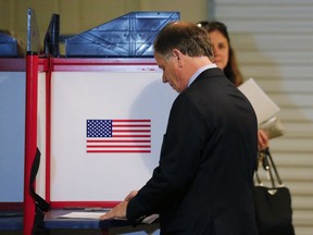 Democratic candidate for U.S. Senate Doug Jones casts his ballot Tuesday, Dec. 12, 2017, in Mountain Brook , Ala.