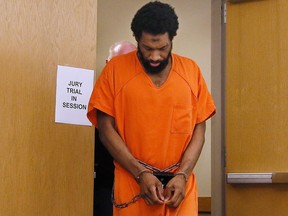 Alton Nolen is led from the courtroom in during jury selection at his Norman, Okla. , murder trial in this Sept. 11, 2017 file photo. (AP Photo/Sue Ogrocki)