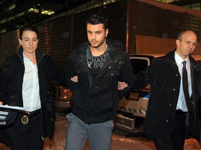 Assmar Shlah is arrested on Dec. 12, 2013, following the death of Lukas Strasser-Hird outside a Calgary nightclub.