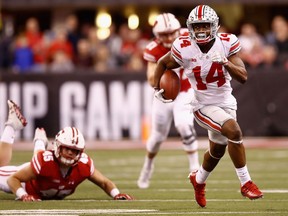 Wide receiver K.J. Hill of the Ohio State Buckeyes runs the ball against the Wisconsin Badgers on Dec. 2, 2017
