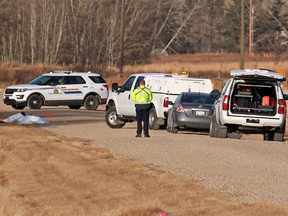 RCMP officers investigate after a body was discovered east of Calgary near Township Road 232 and Range Road 282 on Wednesday December 6, 2017. Gavin Young/Postmedia