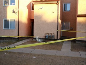 Police tape marks a unit in a Rundle condominium complex where Cory Lance Runner was fatally stabbed on Thursday December 7, 2017.