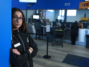 Nicole Dunai with the Sage Hill Bottle Depot is saddened by the recent theft of employee tip box and a Calgary Food Bank cash donation box. She was photographed Tuesday, December 19, 2017.  Gavin Young/Postmedia