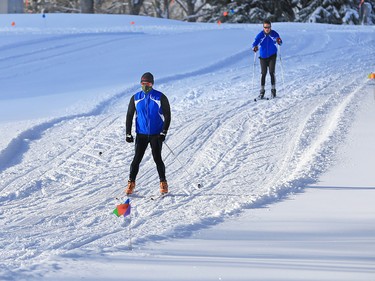Graham Schielbel, left and Austin Beever wasted no time taking advantage of fresh snow for a cross-country ski at Confederation Park Golf Course on Wednesday December 20, 2017 An overnight winter storm hit Calgary leaving over 20 centimetres in parts of the city.