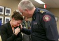 A tearful Jen Ward cries and is comforted by Police Chief Roger Chaffin after she resigned her position of a Calgary Police Service officer in Calgary, Alta on Tuesday January 31, 2017. 

Ward stood in front of the Police commission and cited bullying and harassment as the reasons for her resigning her position. Her husband continues as a member of the police force. Jim Wells/Postmedia