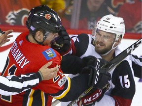 Flames Garnet Hathaway (L) gets a glove in the face from Coyotes Brad Richardson  during NHL action between the Arizona Coyotes and and the Calgary Flames in Calgary on Thursday, November 30, 2017. Jim Wells/Postmedia

Postmedia Calgary
