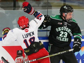 Greater Vancouver Canadians Van Lupien collides with Evan Woods of the Okotoks Bow Mark Oilers during the Mac's Midget AAA World Invitational Tournament on Tuesday, Dec. 26, 2017 in Calgary.