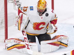 Flames goalie David Rittich makes a save during third period NHL action against the Canadiens in Montreal on Thursday, Dec. 7, 2017.