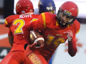 UofC Dinos Michael Klukas runs a punt back for a touchdown against the UBC Thunderbirds in university football action at McMahon Stadium in Calgary, Alta.. on Friday September 4, 2015.