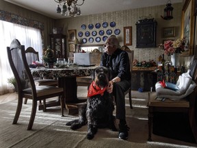 Hans Granholm pictured with his dog Parker in Edmonton Alta, on Thursday December 7, 2017. Parker is not yet five years old and has been giving blood regularly for nearly three of them. "He just gave his 12th donation," said Hans Granholm of Edmonton. The rescue dog, which had to go through a series of tests to make sure he was eligible to donate, doesn't seem to mind the donor sessions at all.