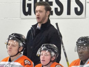 The Drumheller Dragons new head coach Darryl Olsen watches his team play against the Canmore Eagles at the Fenlands Arena in Banff on Tuesday, January 31, 2017. photo by Pam Doyle