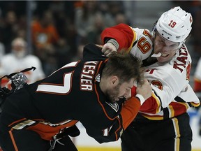 Calgary Flames left wing Matthew Tkachuk, right, fights with Anaheim Ducks center Ryan Kesler during the first period of an NHL hockey game in Anaheim, Calif., Friday, Dec. 29, 2017.