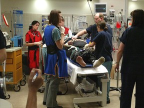 A patient is tended to inside a trauma bay at Foothills Medical Centre. Ted Jacob/Postmedia File