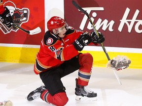 Calgary Hitmen sniper Vladislav Yeryomenko scores on Moose Jaw Warriors goalie Adam Evanoff to kick off the 23rd Teddy Bear Toss at the Scotiabank Saddledome in Calgary, Alta., on Sunday, December 10, 2017.