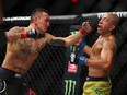 Max Holloway (left) battles Jose Aldo of Brazil during UFC 218 at Little Caesars Arena on December 2, 2018 in Detroit.