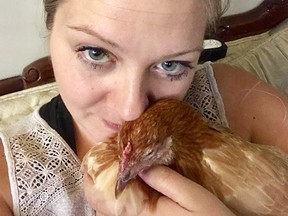 Nikki Pike poses with one of her emotional support hens. Supplied photo