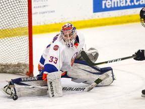 New York Jr. Islanders goalie Anthony Aureliano stops the Lethbridge Hurricanes' Michael Horon during Thursday's game action at the Mac's AAA Midget Hockey Tournament at Father Bauer arena in Calgary, Alta., on Thursday, December 28, 2017.