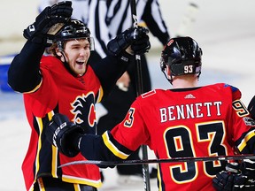 Calgary Flames Sam Bennett celebrates with teammate Mark Jankowski after scoring against the St. Louis Blues in NHL hockey at the Scotiabank Saddledome in Calgary on Monday, November 13, 2017.