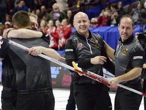 Team Koe lead Ben Hebert, left to right, third Marc Kennedy, skip Kevin Koe and second Brent Laing celebrate their win over Team McEwen during the men's final at the 2017 Roar of the Rings Olympic Curling Trials in Ottawa on Sunday, December 10, 2017. Hebert and Kennedy are back curling in the Olympic Games with another skip named Kevin. Eight years after winning gold with Kevin Martin in Vancouver, they'll head to Pyeongchang with skip Kevin Koe. Experience helps, but Hebert says it will be a "heck of a lot tougher" to win gold than in 2010.