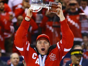 Curtis Lazar raises the trophy as of Team Canada celebrates the win over Team Russia during the Gold Medal game of 2015 World Junior Hockey Championships at the Air Canada Centre in Toronto on Monday January 5, 2015.