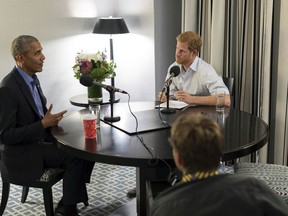 In this undated photo issued on Sunday Dec. 17, 2017 by Kensington Palace courtesy of the Obama Foundation, Britain's Prince Harry, right, interviews former US President Barack Obama as part of his guest editorship of BBC Radio 4's Today program, broadcast on Dec. 27, 2017. The interview was recorded in Toronto in September 2017 during the Invictus Games.