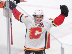 Calgary Flames centre Sean Monahan (23) celebrates after scoring the winning goal against the Montreal Canadiens during overtime NHL hockey action Thursday, December 7, 2017 in Montreal.