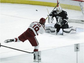 Providence goalie Hayden Hawkey (31) makes a save on a shot by Harvard's Adam Fox (18) during the first period of an NCAA regional men's college hockey tournament game, Friday, March 24, 2017 in Providence, R.I.