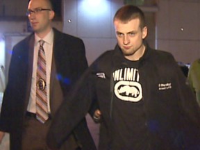 January 19, 2013 - Walker Risling at the Arrest Processing Unit with two Major Crimes Detectives on Jan. 18, 2013. He was charged with second degree murder in the stabbing death of Matthew Brown, Jan. 5, 2013 in Taradale. Courtesy CBC.