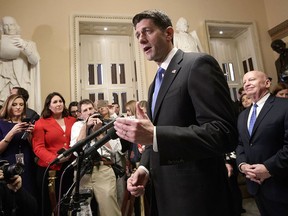 Speaker of the U.S. House of Representatives Paul Ryan, R-Wis., joined at right by House Ways and Means Committee Chairman Kevin Brady, R-Texas, meets reporters just after passing the Republican tax reform bill in the House of Representatives, on Capitol Hill, in Washington, Tuesday, Dec. 19, 2017. (AP Photo/J. Scott Applewhite)