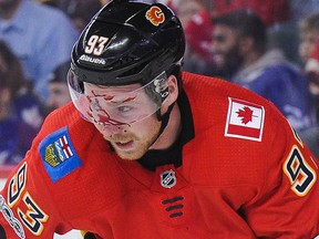 Sam Bennett of the Calgary Flames bleeds after taking a puck to the face at Scotiabank Saddledome on Nov. 28, 2017