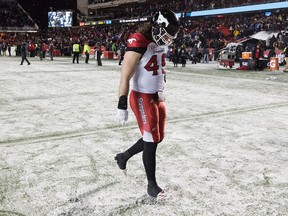 Calgary Stampeders linebacker Alex Singleton walks off the field after being defeated by the Toronto Argonauts in the 105th Grey Cup on Nov. 26, 2017