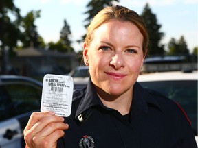 Calgary Police Service Cst. Helen Schott poses with a Narcan bottle in Calgary on Friday, July 7, 2017.