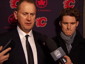 Flames GM Brad Treliving and forward Matthew Tkachuk speak to the media Thursday night in Montreal.