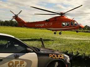 In this file photo, a man is loaded into an Ornge air ambulance in Norwood Township, between Peterborough, Ont. and Norwood, Ont., on Tuesday, June 27, 2017.
