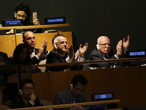 NEW YORK, NY - DECEMBER 21:  Members of the Palestinian delegation leave the General Assembly hall after a vote on the floor of the United Nations General Assembly in which the United States declaration of Jerusalem as Israel's capital was declared "null and void" on December 21, 2017 in New York City. The vote, 128-9, at the United Nations concerned Washington's decision to recognize Jerusalem as Israel's capital and relocate its embassy there. The Trump administration has threatened to take action against any country that votes against the United States decision to move its embassy.  (Photo by Spencer Platt/Getty Images)