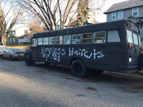 Racist threats scrawled on a bedsheet accompanied vandalism found on a bus parked outside the Calgary home of Misty Wind. Supplied photo