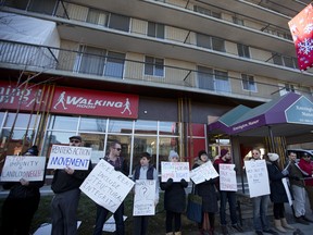 Residents and members of Renters Action Movement protest outside Kensington Manor in Calgary on Saturday December 16, 2017.