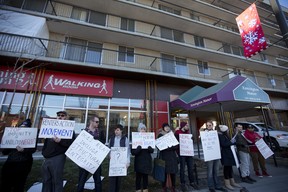 Residents and members of Renters Action Movement protest outside Kensington Manor in Calgary on Saturday December 16, 2017.