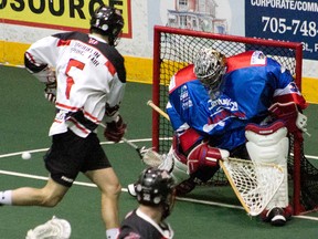 Mitch Wilde takes a shot on Peterborough Lakers goalie Matt Vinc while a member of the Brooklin Redmen on Aug. 8, 2017.