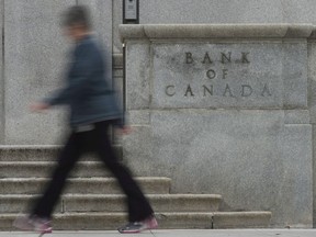 A woman walks past the Bank of Canada Wednesday September 6, 2017 in Ottawa.