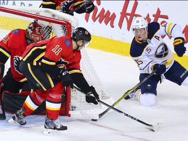 The Calgary Flames' Mikael Backlund and goaltender Mike Smith stopped this scoring chance by the Buffalo Sabres' Jack Eichel during NHL action at the Scotiabank Saddledome on Calgary on Monday January 22, 2018.