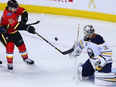 The Calgary Flames' Garnet Hathaway wasn't able to get this shot past Buffalo Sabres goaltender Chad Johnson during NHL action in Calgary on Monday January 22, 2018. The Sabres won 2-1 in overtime.