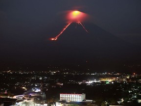 Lava from Mayon volcano is seen as it erupts in Legazpi on January 15, 2018.