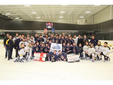 The NW Warriors won gold and the Saints silver in the Bantam 2 division at Esso Minor Hockey Week. The teams wanted to be photographed together after playing the final on Saturday.